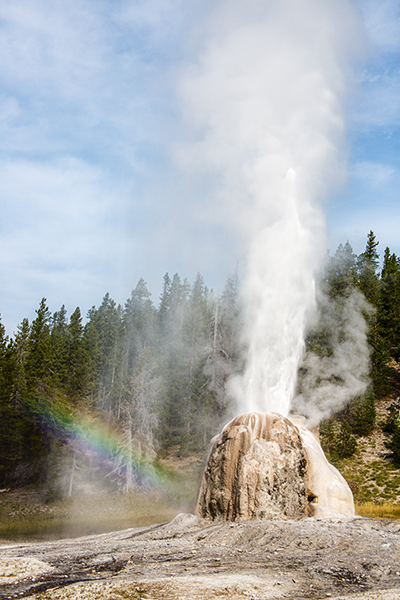 Lonestar Geyser in eruption with a rainbow